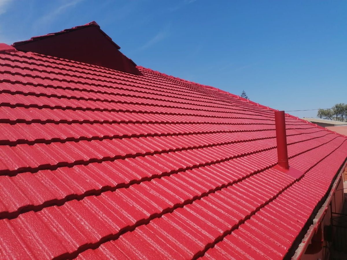 Red roof coating project by JJ Construction